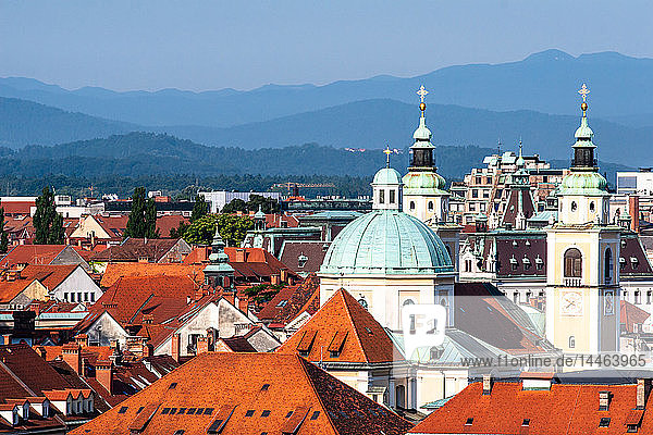 City rooftops with mountains  Ljubljana  Slovenia