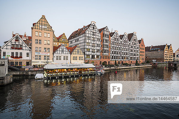 Hanseatic League houses on the Motlawa River at sunset  Gdansk  Poland