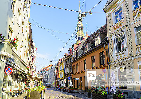 Grecinieku Street with St. Peter's Church in background Old Town UNESCO World Heritage Site Riga Latvia