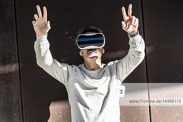 Mature man using VR glasses