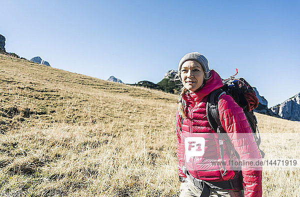 Austria  Tyrol  smiling woman on a hiking trip in the mountains