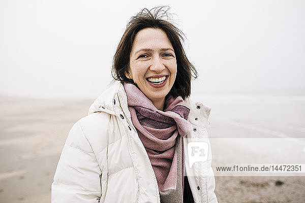 Portrait of laughing woman on the beach