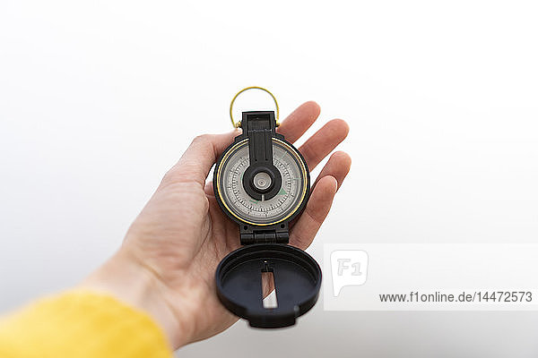 Woman's hand holding compass