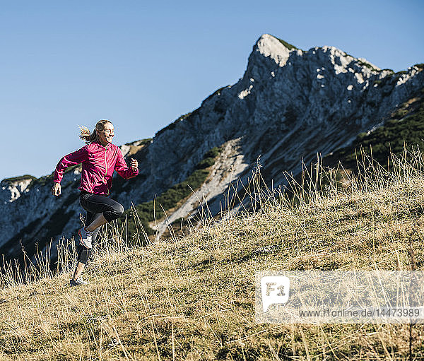 Austria Tyrol woman running in the mountains