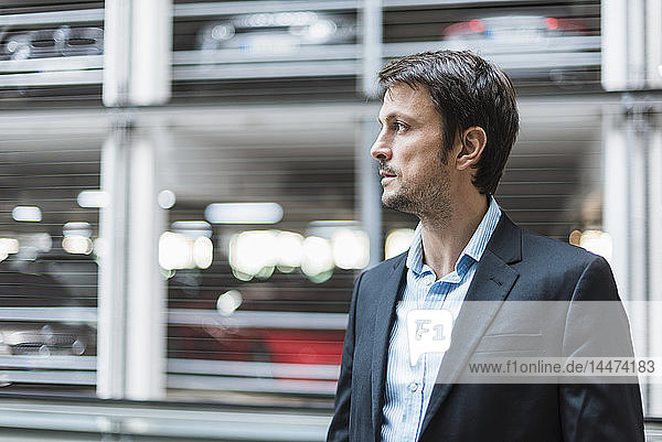 Portrait of a businessman  standing in parking garage