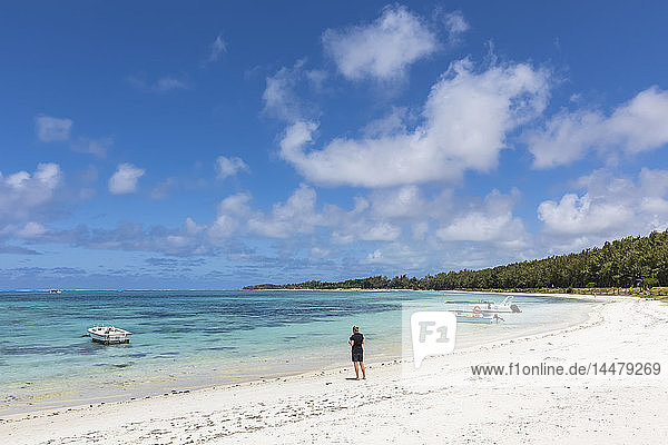Mauritius  Indian Ocean  Flacq  East Coast  female tourist at beach of Belle Mare