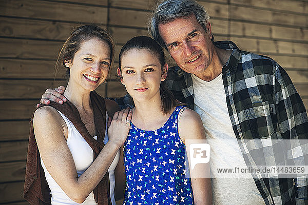 Portrait of family standing outdoors