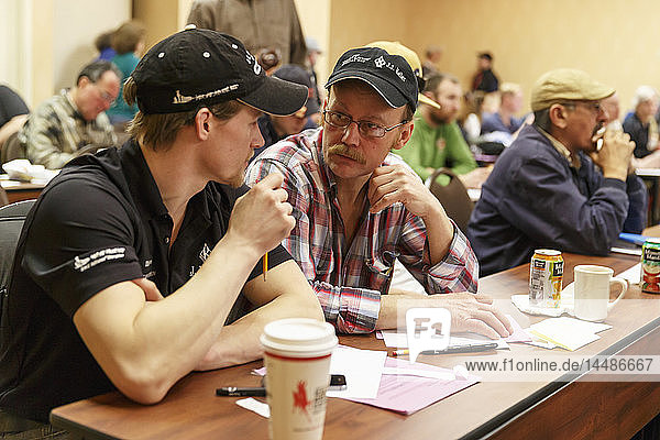 Father and son mushers  Dallas and Mitch Seavey  at the 2015 Iditarod musher meeting  Anchorage  Southcentral Alaska
