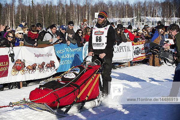 Mike Ellis heads down the chute during the restart of the 2014 Iditarod  Willow  Southcentral Alaska
