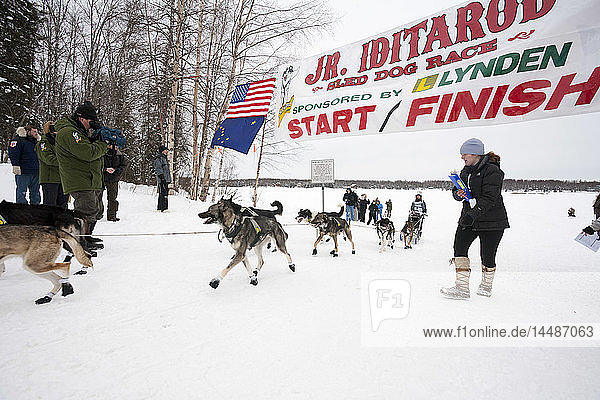 Anitra Winkler crosses the finish line in 2nd place at the 2010 Junior Iditarod Sled Dog Race  Willow  Southcentral AK