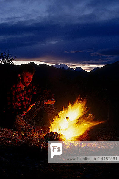 Camper by Fire Peters Hills/nS of Mt McKinley Interior Alaska