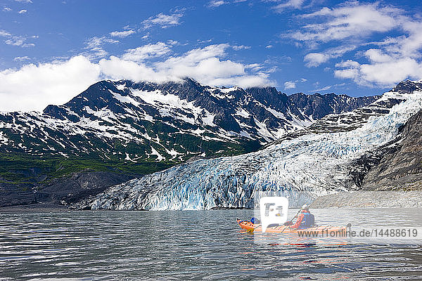 Couple kayaking in Shoup Bay with Shoup Glacier in the background  Prince William Sound  Southcentral Alaska