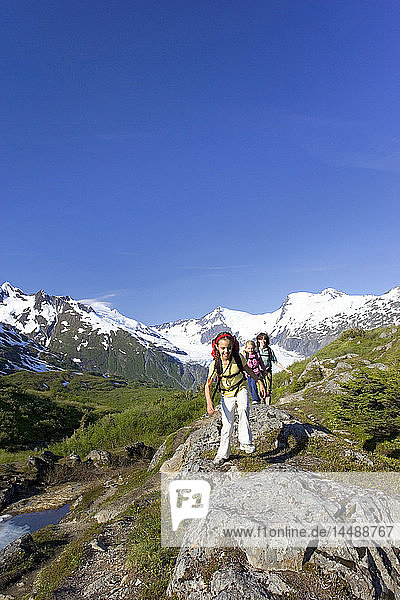 Family viewing scenery on Portage Pass Summit w/Portage Glacier Chugach Mtns & National Forest Southcentral Alaska Summer
