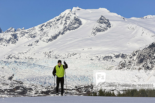 Nordic skier enjoying the wide open and uncrowded skiing in the Juneau area  Mendenhall Glacier and Towers beyond  Alaska.