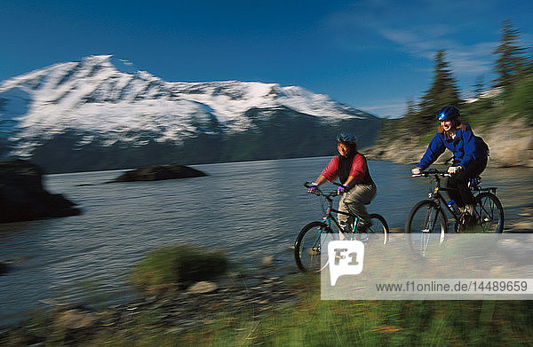 Women Biking on Beach Bird Point Southcentral Alaska