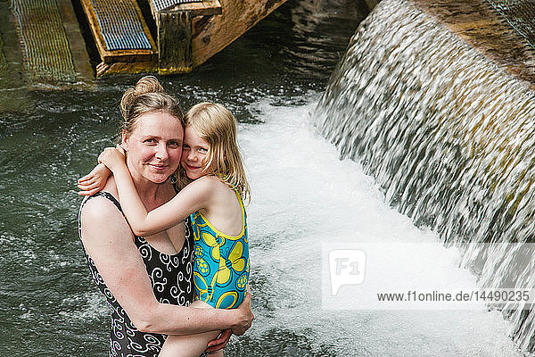 Woman and daughter in Liard Hot Springs  British Columbia  Canada  summer
