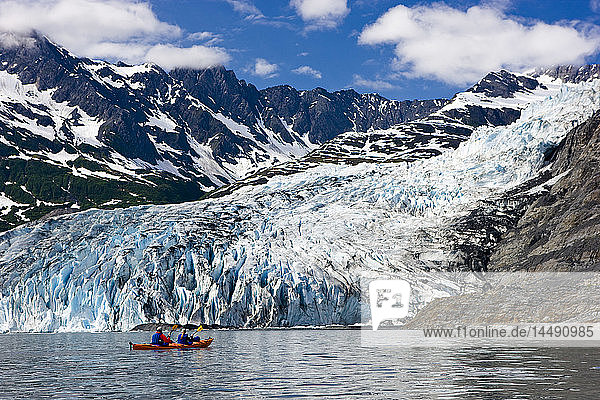 Couple kayaking in Shoup Bay with Shoup Glacier in the background  Prince William Sound  Southcentral Alaska