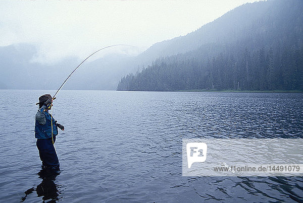 Woman Flyfishing on Manzanita Lake Misty Fjords NP Alaska