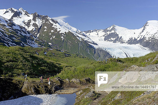 Family hiking Portage Pass trail Chugach Mtns w/Portage Glacier Alaska Summer Chugach Nat Forest