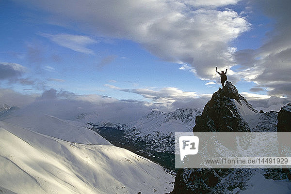 Climber on ridge peak Chugach State Park SC AK winter scenic