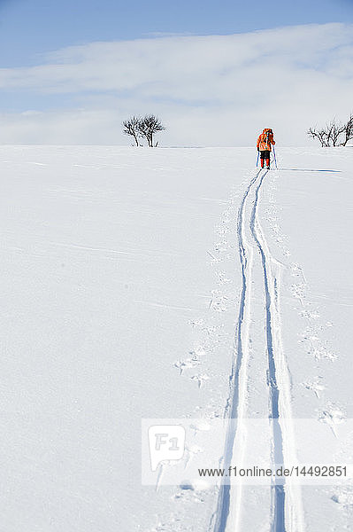 Woman hiking on snow