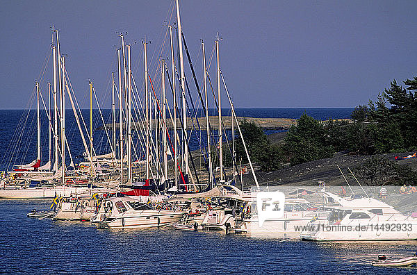Sailing boats moored in bay