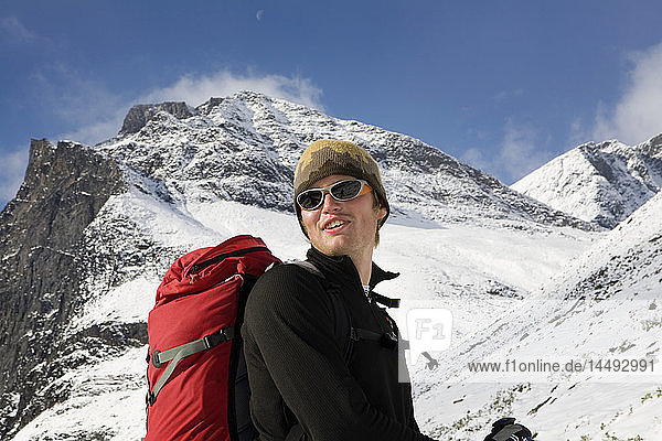Man with rucksack at snowy Kebnekaise mountain