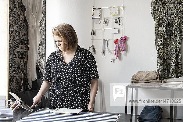 Woman in clothes shop