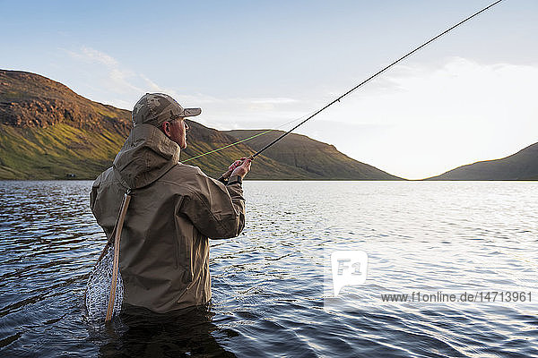 Man fishing in lake