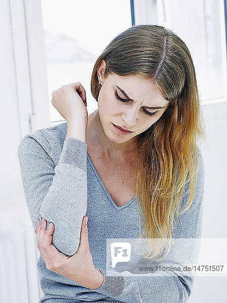 Woman with elbow pain
