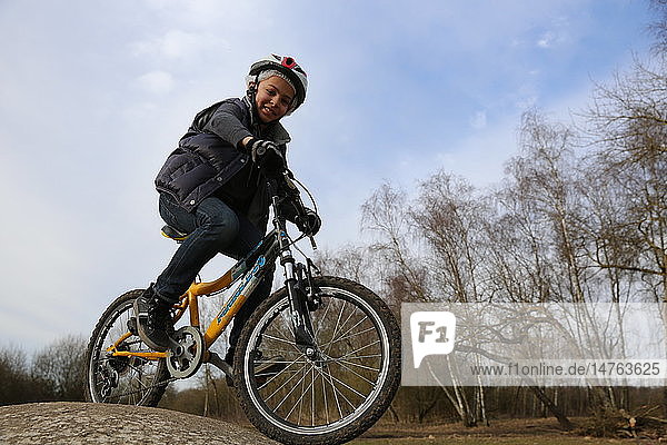 9-year-old boy on a bicycle.