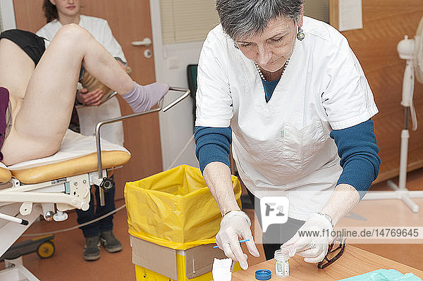 Reportage on the Handi-Consult 06 gynecology practice in the Rossetti Centre Nice France. Handi-Consult 06 provides consultations for disabled adults requiring a substantial amount of setting up and accompanying time. Gynecology consultation with a GP qualified in gynecology and with the help of an auxiliary nurse. This patient suffers from dystonia.