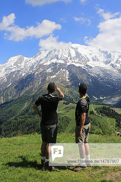 Two teenagers watching Mont Blanc massif.