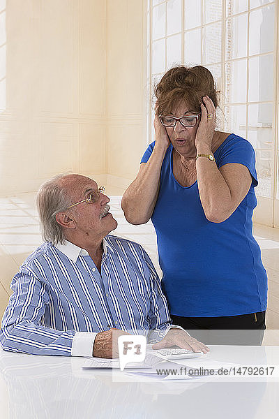 Senior couple doing paperwork.