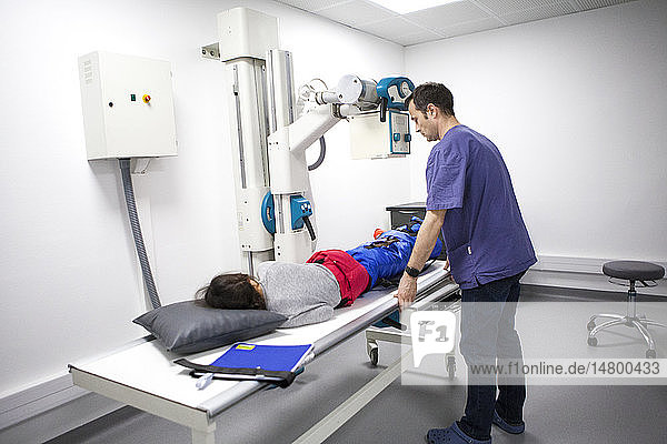 Reportage on a mountain rescue doctor working in both the Carroz and de Flaine ski resorts in Haute-Savoie France. He treats skiers and snowboarders who have been injured on the slopes. A young girl has a leg x-ray following a skiing accident.