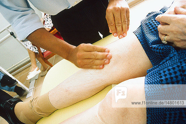 ELDERLY PERSON BEING MASSAGED