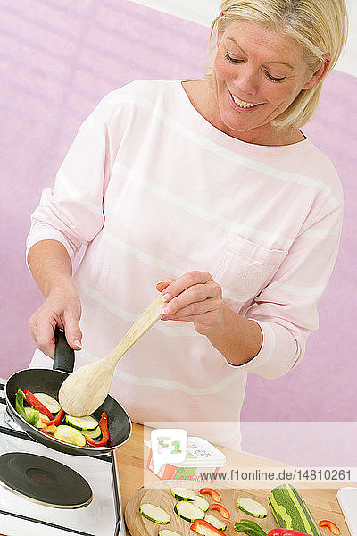 ELDERLY PERSON IN KITCHEN