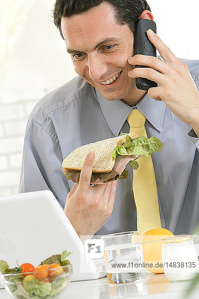 MAN EATING A SANDWICH