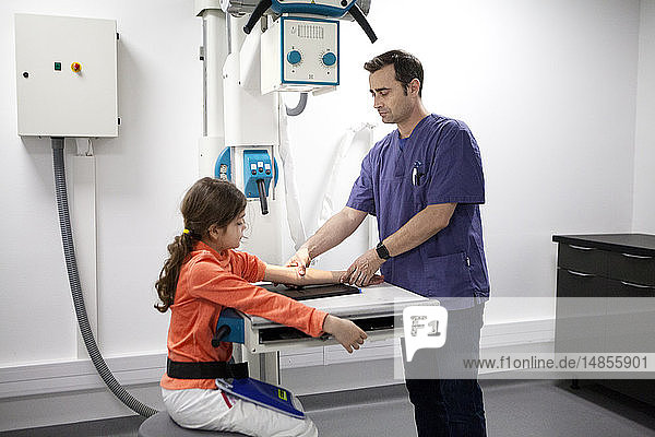 Reportage on a mountain rescue doctor working in both the Carroz and de Flaine ski resorts in Haute-Savoie France. He treats skiers and snowboarders who have been injured on the slopes. A young girl has an arm x-ray following a skating accident.