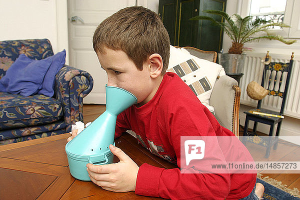 CHILD TAKING INHALATION