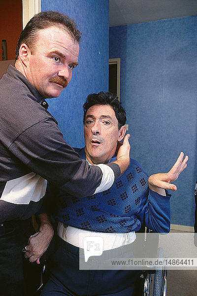 MALE NURSE WASHING DISABLED PERS