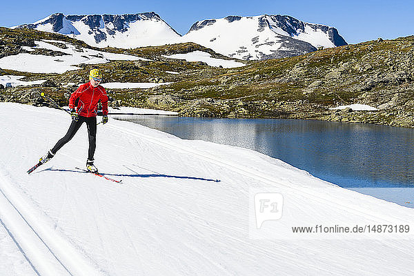 Man cross-country skiing in mountains