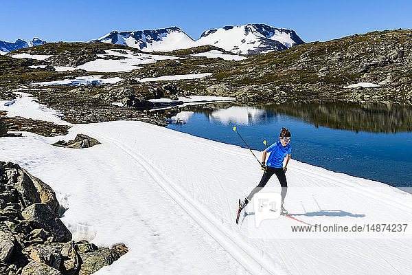 Boy cross-country skiing in mountains