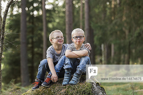 Boys posing in forest