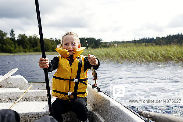 Boy fishing on lake