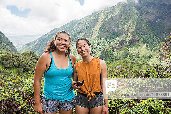 Hikers posing for photograph in rainforest  Iao Valley  Maui  Hawaii