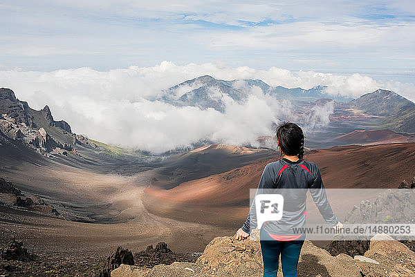 Hiker on edge of mountain top  Haleakala National Park  Maui  Hawaii