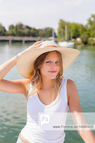 Young woman on sailboat  portrait  Chiemsee lake  Bavaria  Germany
