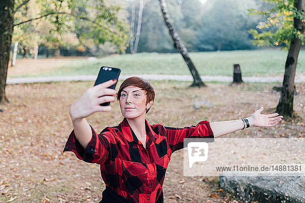 Woman taking selfie in countryside  Rezzago  Lombardy  Italy