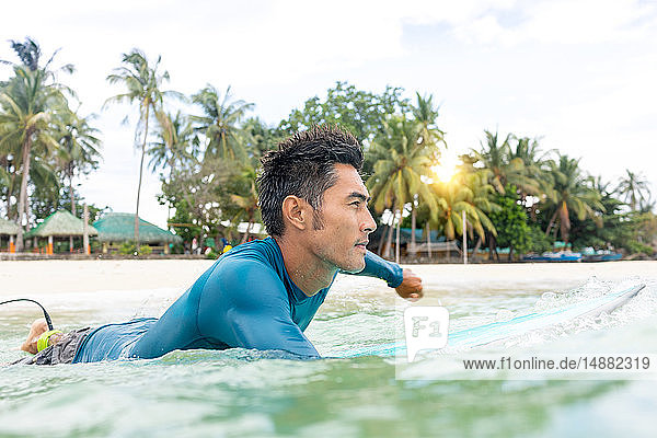 Surfer waiting in sea  Pagudpud  Ilocos Norte  Philippines